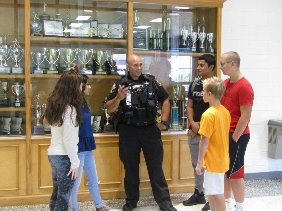 SRO+Deputy+Jones+talks+to+students+about+the+importance+of+school+safety+and+his+job+at+Stone+Bridge.